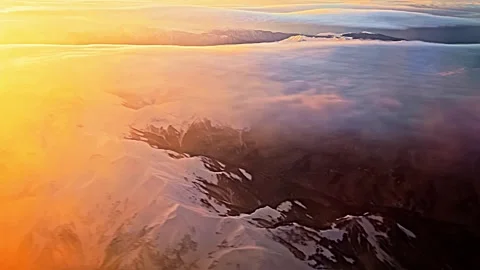 The sky is orange and the clouds are white Stock Footage 275326183
