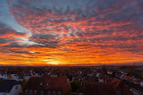 The sky is orange and the sun is setting Stock Photos