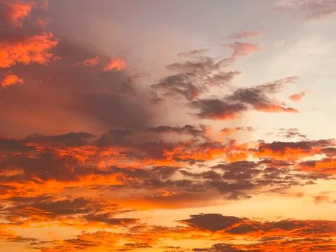 Sky with Orange Clouds during Sunset Stock Photos