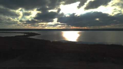 Sky Over the River with Rays of Light Shining Through Clouds Stock Footage 123020916