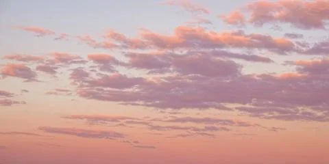 The sky is painted with clouds that are softly lit from below. Stock Photos
