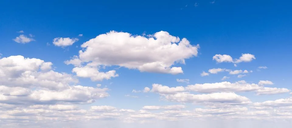 Sky pattern with cumulus clouds. Blue sky frames white clouds. Bright sky c.. Stock Photos