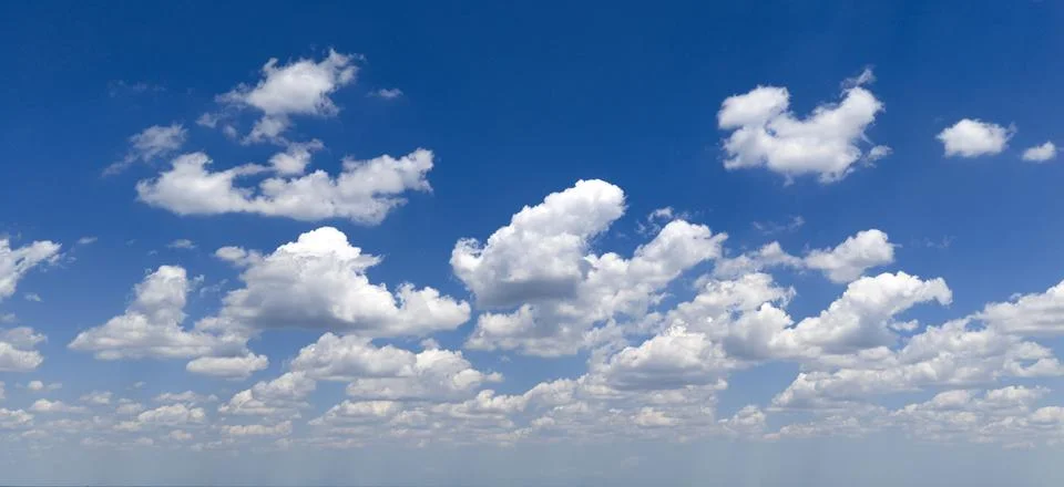 Sky pattern with cumulus clouds. Blue sky frames white clouds. Bright sky con Stock Photos