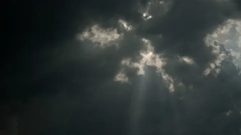The sky with rain clouds through which the sun's rays break through. Stock Footage 197452729