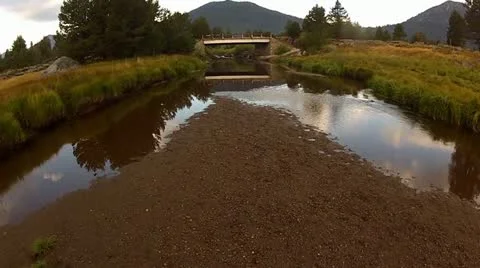 Sky reflected on a calm river Stock Footage 12726663
