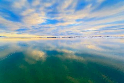 The sky reflected in the ice Stock Photos