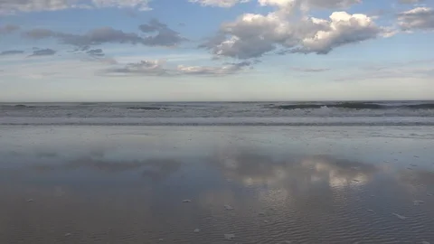 Sky Reflecting on Beach - Tilt Down Stock Footage 88448593