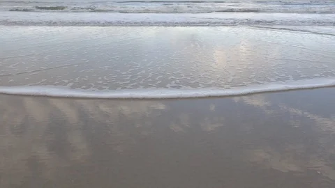 Sky Reflecting on Beach - Tilt Up Stock Footage 88448616