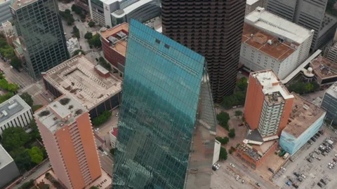 Sky Reflecting In Tilted Glass Facade Of 