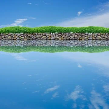 Sky reflection on calm pond Foto stock