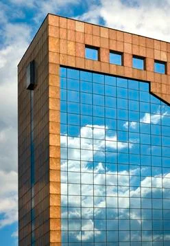 Sky reflection with clouds on the windows of the building Stock Photos