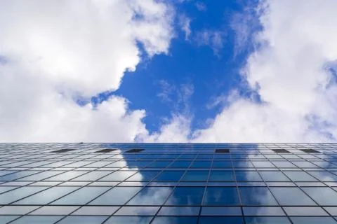Sky reflection on glasses of the building Stock Photos