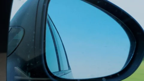 Sky reflection in right side rear view mirror at car driving Stock Footage 109164759