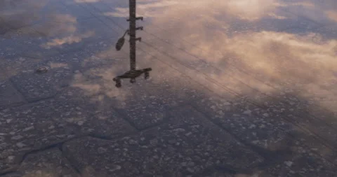 Sky reflection on the water surface of the puddle Stock Footage 131667185