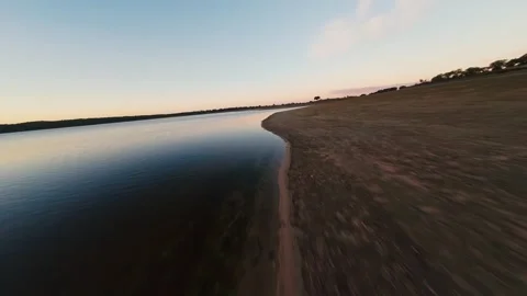 Sky reflects softly on calm water's surface at Pego do Altar Reservoir Video stock 342160353