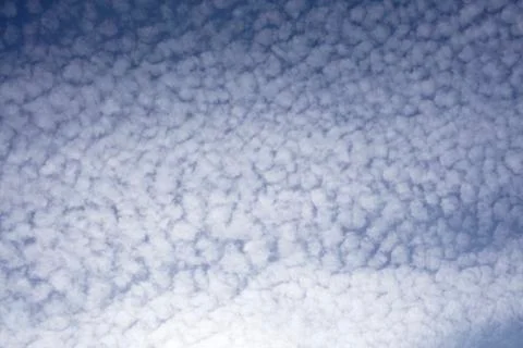 Sky with rows of cirrocumulus clouds Stock Photos