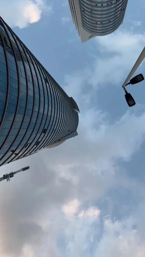 Sky running clouds with office buildings, shot from ground to up Stock Footage 231105148
