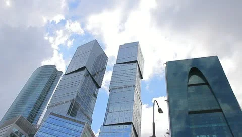 The sky-scraper time lapse clouds reflection Stock Footage 10902800