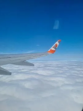 Sky seen through the window of an airplane Stock Photos