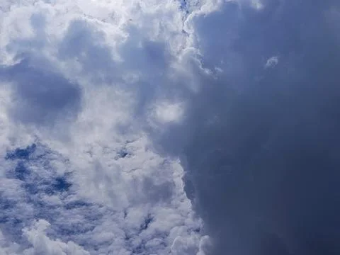 Sky showing dark storm clouds moving in to cover a bright blue sky 库存照片
