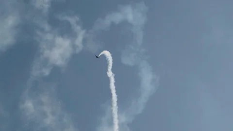 In the sky, a single-engine plane spins and leaves a beautiful trail Stock Footage 115545218