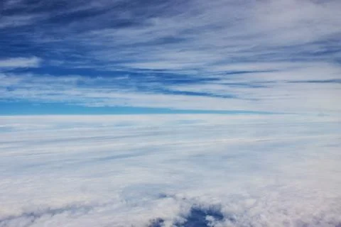 The sky with some clouds during a flight Stock Photos