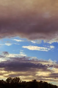 Sky with some dramatic clouds and vibrant colors at golden hour Stock Photos