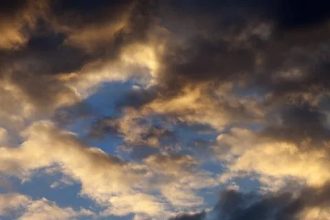 Sky with storm clouds at sunset Stock Photos