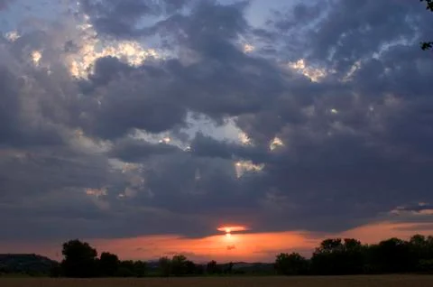 Sky of storm with sunset Stock Photos