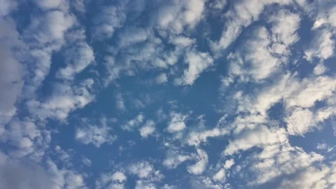 Sky stretches wide, soft clouds drift lazily Stock Footage 335658589