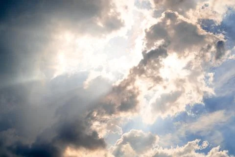 The sky with sunlight shining through the rain clouds. Stock Photos