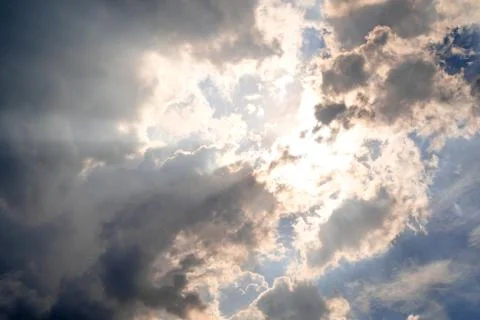 The sky with sunlight shining through the rain clouds. Stock Photos
