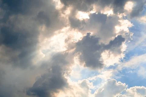 The sky with sunlight shining through the rain clouds. Stock Photos