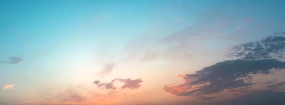 Sky at sunset with dark clouds, panoramic large shot. Background from the c.. Stock Photos