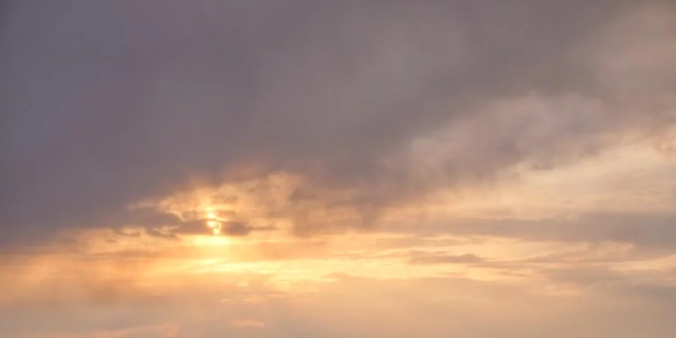 The sky at sunset. Dramatic cloudy sky as background. Stock Photos