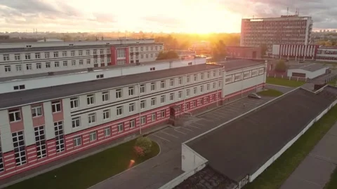 The sky into the sunset. The drone flies over the roof of houses into the sunset Stock Footage 194140670