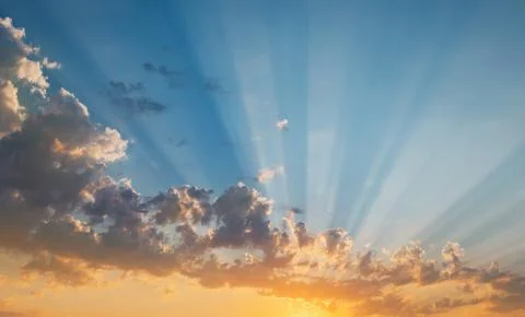 Sky at sunset with rays of the sun Stock Photos