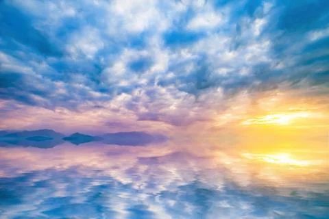 Sky at sunset reflected in water Stock Photos