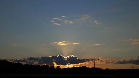 Sky at sunset. The sun has set behind the clouds.  Dynamic bottom-up shooting Stock Footage 126118178