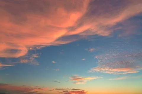 Sky at sunset texture background overlay. Dramatic orange clouds. Stock Photos