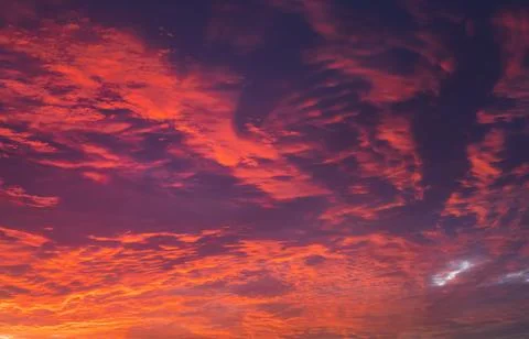 Sky at sunset texture background overlay. Dramatic red clouds. Stock Photos