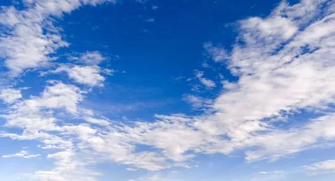 Sky texture with blue clouds. Soft sky white cloud texture backdrop. Bright.. Stock Photos