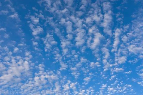 Sky texture with cirrus clouds. Bright sky blue backdrop. Soft white sky wall Stock Photos