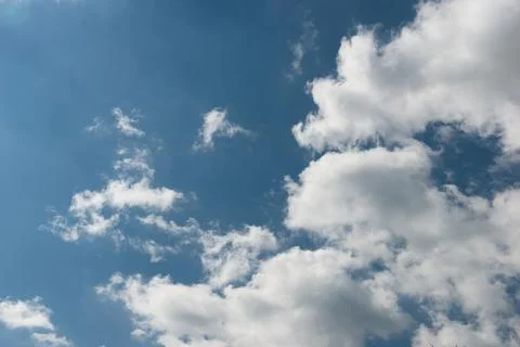 Sky texture with half white clouds and half blue sky Stock Photos