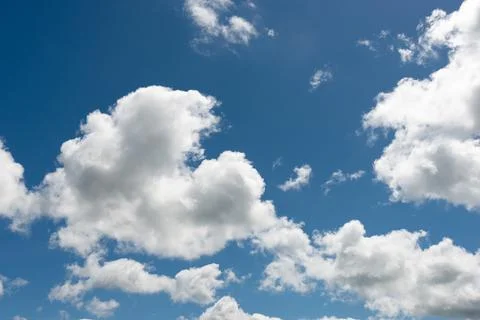 Sky texture with white clouds on a blue sky Stock Photos