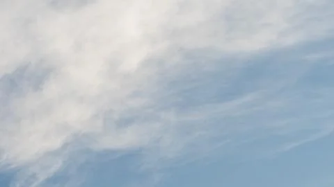 Sky with thin white clouds. Thin whiskey-colored clouds in a blue sky, a vi.. Stock Photos