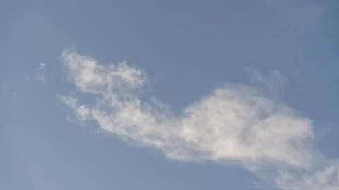 Sky with thin white clouds. Thin whiskey-colored clouds in a blue sky, a view of Stock Photos