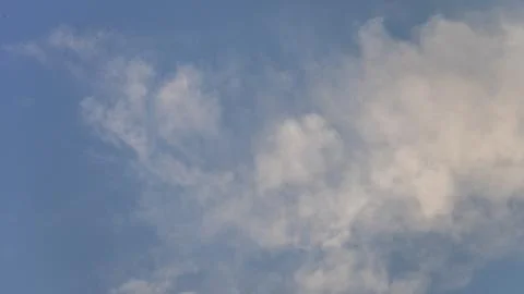 Sky with thin white clouds. Thin whiskey-colored clouds in a blue sky, a view of Stock Photos