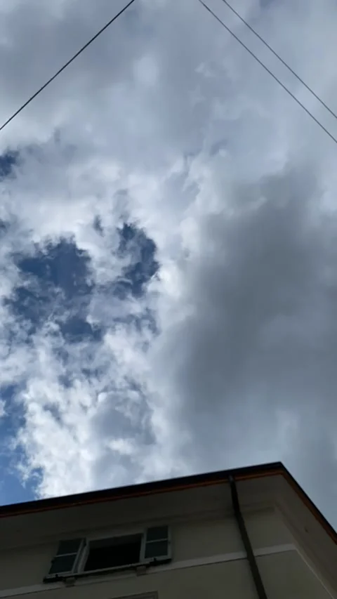 Sky time lapse in the city, clouds and blue background. Video stock 242972755