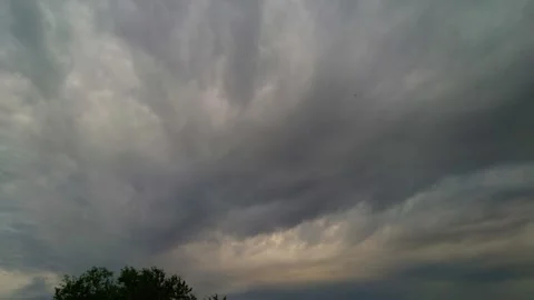 Sky Time-Lapse of Incoming Dark Storm Clouds Gathering Over Countryside Horizon Vídeos de archivo 345182446